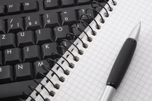 computer keyboard and organizer with pan in business office