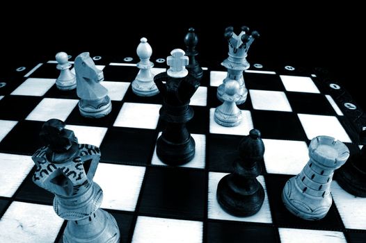 chess pieces on chess board showing competition success and strategy in business