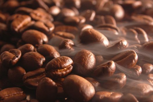 roasting coffee beans with steam and smoke