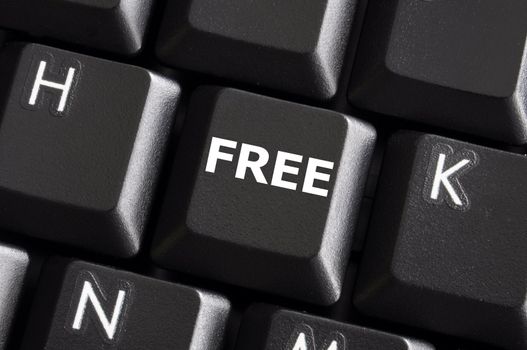 computer keyboard with word free on a button or key