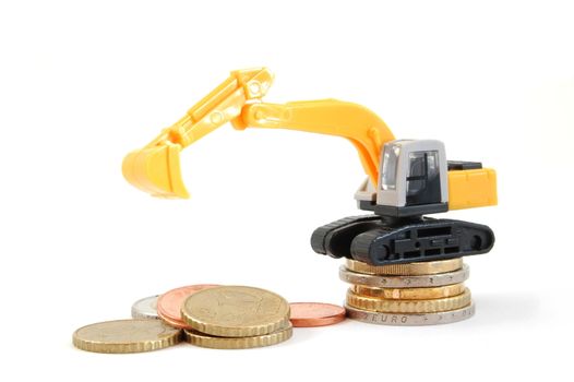 making euro money coins with digger isolated on white background
