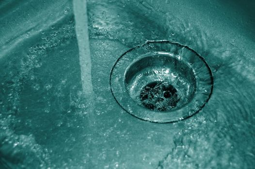 water flow into the drain in the kitchen