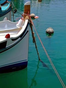 Colorful Fishing boat moored in a valley in Malta