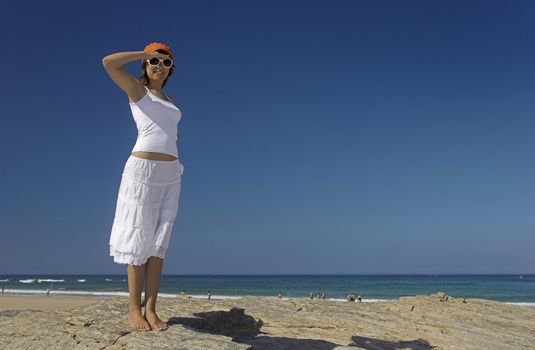 Woman in a beautiful morning on the beach