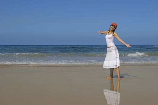 Woman in a beautiful morning on the beach