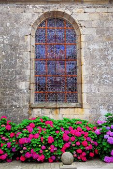 Stained glass church window on Carnac, Brittany, France.