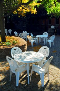 Empty tables of outdoor cafe in the fall