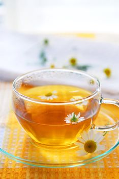 A teacup with soothing herbal camomile tea