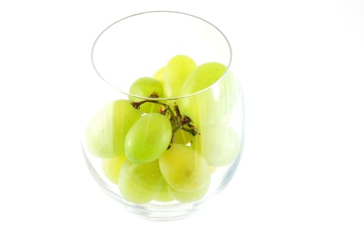 Its a grape in a glass isolated on white background.