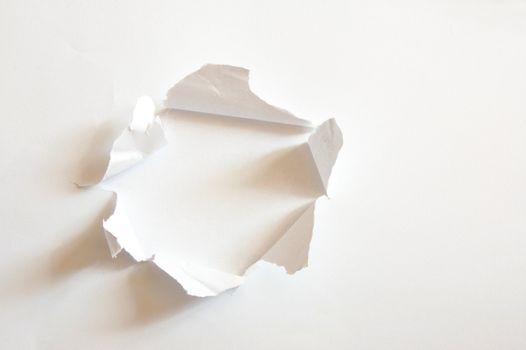 hole with copyspace in blank sheet of paper