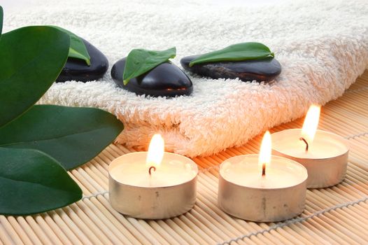 towel and zen stones showing a bath or wellness concept
