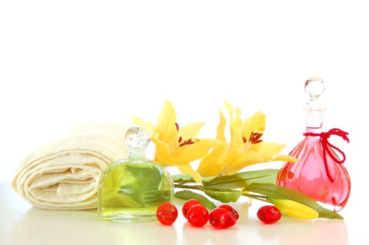 massage still life with bottle of oil and towel