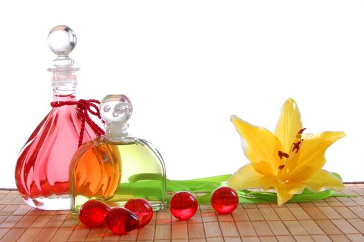 romantic spa or massage still life with red bottle oil