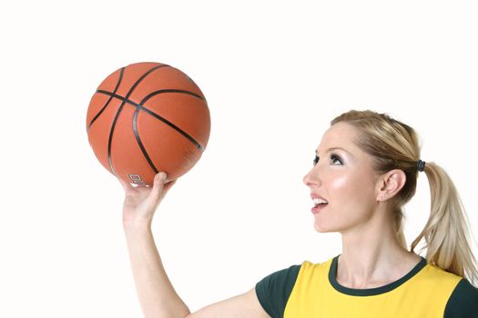 Female playing with a basketball - shooting hoops