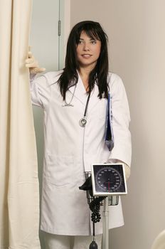 Doctor or nurse with sphygmomanometer (blood pressure instrument)


