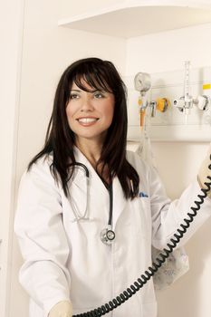 Medical worker in ward with instruments
