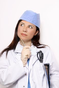 Healthcare worker in scrubs uniform and doctor coat.
