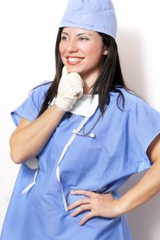 Healthcare professional against a white wall and looking sideways
