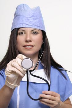 Female  nurse extending a stethoscope
