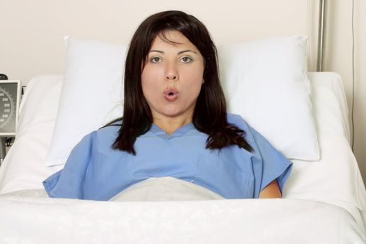 A woman in labour breathing through birth contractions