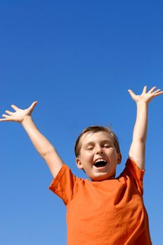 Child showing joy, praise, triumph, excitement - vertical
