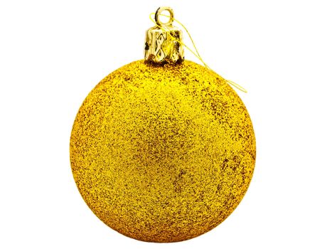 Bright yellow New Year toy against white background