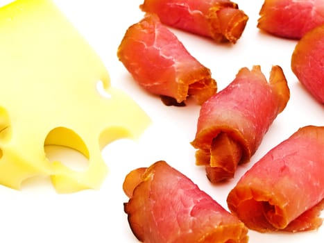 Close up photo of the red tasty smoked meat and yellow cheese