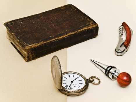 old book, pocket watch and another gentleman things at beige
