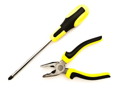 pliers and screwdriver against the white background 
