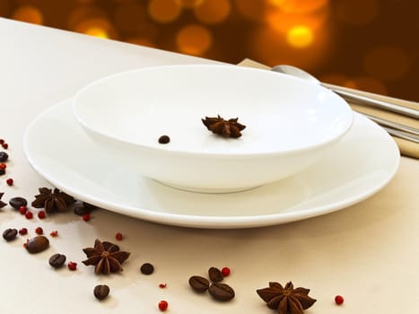 festive table serving with dishware, spice and golden lights