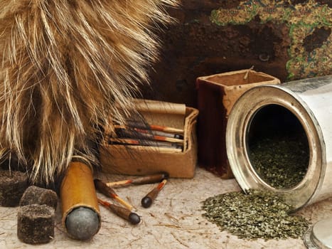 Photo of old matches for hunting with fox brush and gunpowder at beige 