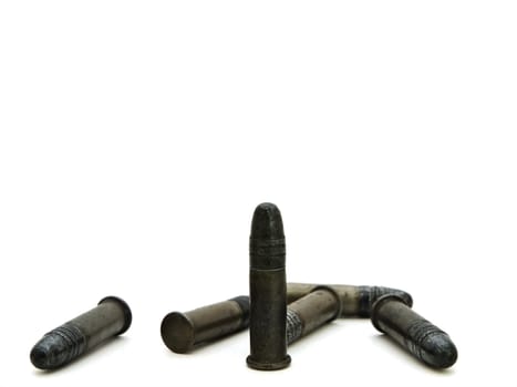 Photo of old metal bullets against white background