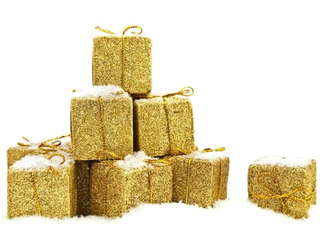 some golden christmas gifts under the snow