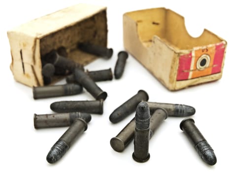 Photo of old  scattered from box metal bullets against white background