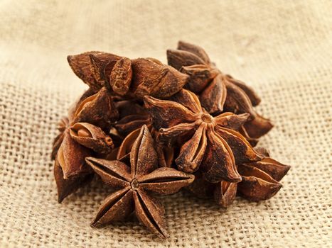 heap of anise star at sacking background