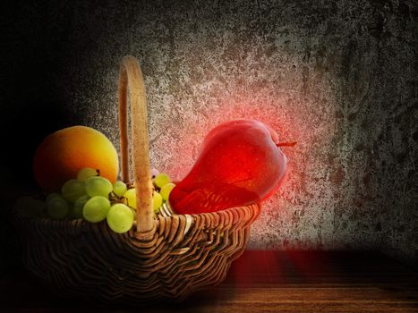 basket with grape, orange and apple lightening bulb against grunge wall