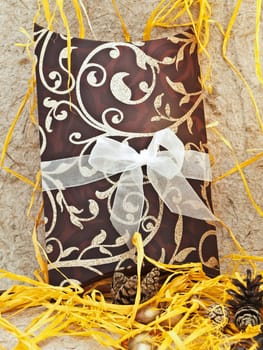 holiday decoration with gift box and cones