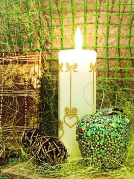 composition with gift, candle and toys against abstract background 