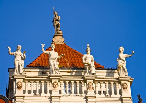 Statues on a house in Gdansk, Pomerania, Poland.