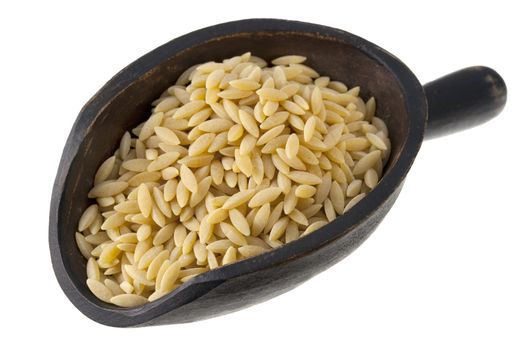 orzo (rosa marina), a rice shaped pasta made of wheat semolina on a rustic wooden scoop isolated on white