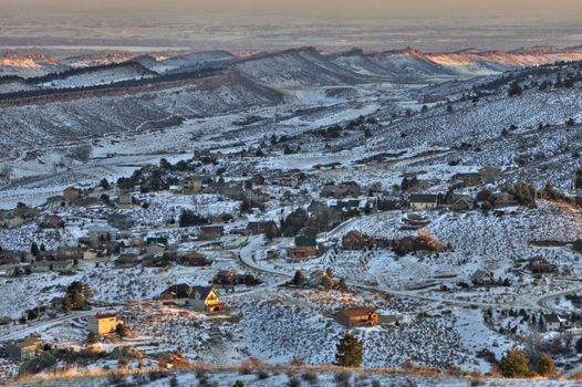 mountain homes in northern Colorado near Fort Collins, view towards southeast from Horsetooth Mountain Park, plains with numerous lakes at background, winter sunset scenery