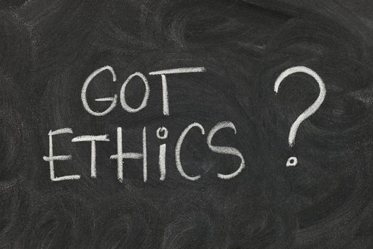 Got ethics? Are you ethical question handwritten with white chalk on blackboard with eraser smudges