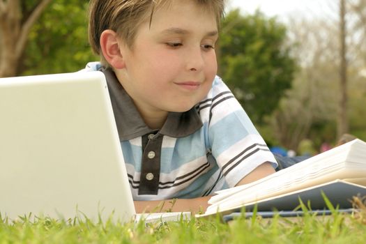 A boy reading or studying.