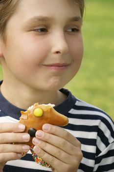 Child eating a sweet treat.