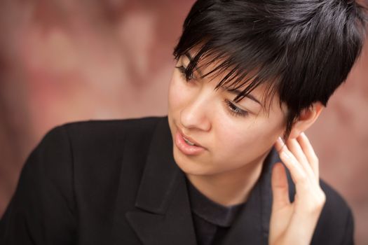 Multiethnic Girl Poses for a Studio Portrait.