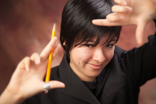 Pretty Multiethnic Girl Poses for Her Portrait Making a Frame with Hands.