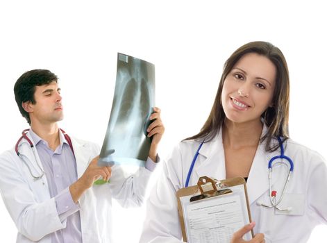Smiling female nurse or doctor and a male doctor holding up an x-ray