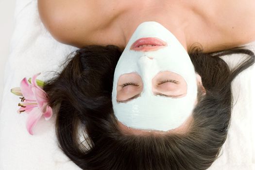 Woman resting with a facial mask