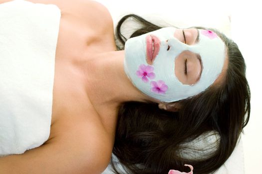 A woman with a botanical mask with rehydrating ceramide serum and vegetarian collagen.  Ultra moisturising for sensitive skin