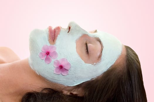 A woman with botanical facial treatment